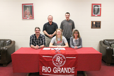 Harley Adler poses with her parents, her brother and Rio Grande coach David Smalley after signing to play for the RedStorm
